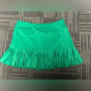 Women’s green Jofit SKORT with shorts underneath pleat at the bottom